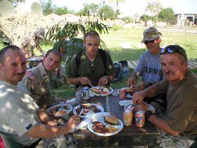 Unit picnic at Camp Babylon with the newly arrived Polish troops on July 27, 2003.