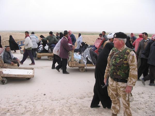 COL Bede Strong watching the foot traffic at the Iranian border. Notice the carts for the luggage, which were a big rental business at the border.