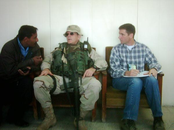 January 2004. I am translating the Spanish spoken by the Iraqi policeman to my right into English for Bob Zangas, seated to my left. Bob was killed in Iraq in March 2004.