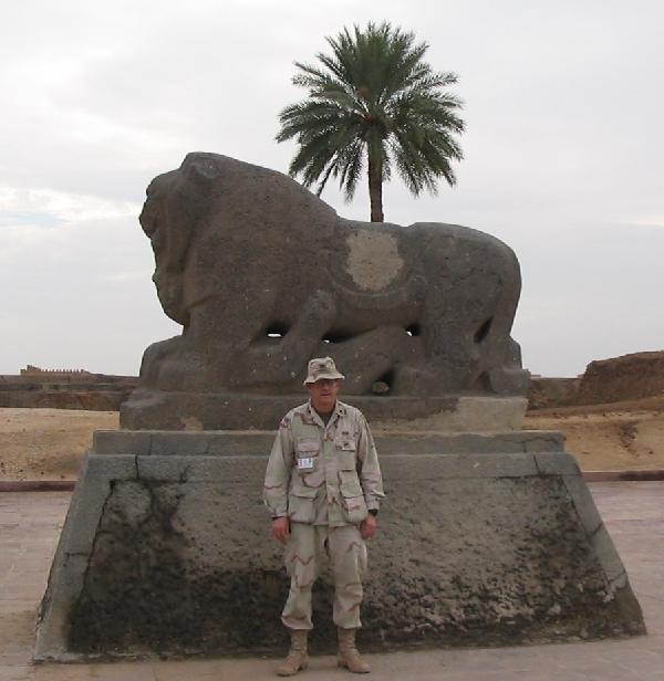 Colonel Michael WHitehead standing before the statue of The Lion of Babylon in August 2003.